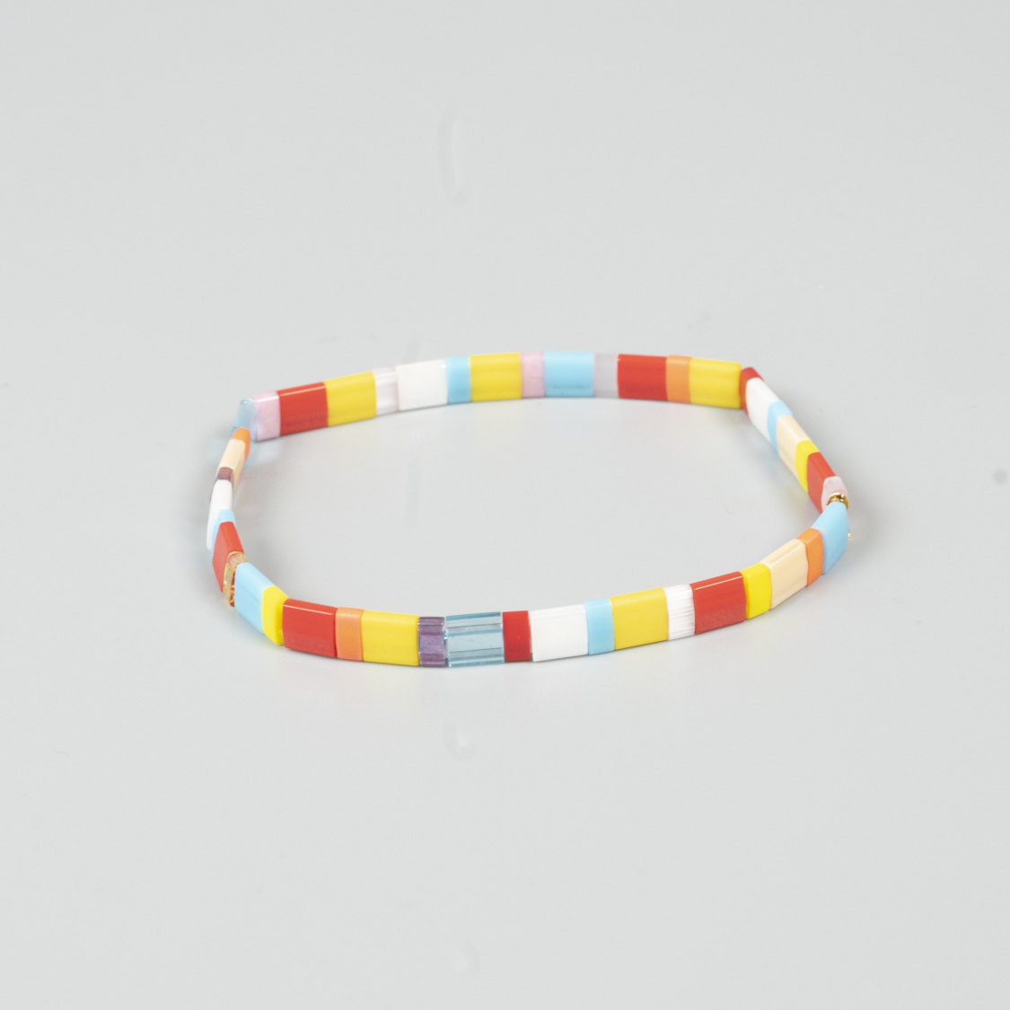 Xia armbånd i gule og røde nuancer fra le mosch