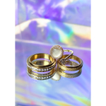 3 anti-stress ringe i guld fra LÉ MOSCH – én med sten og to med drejefunktion.