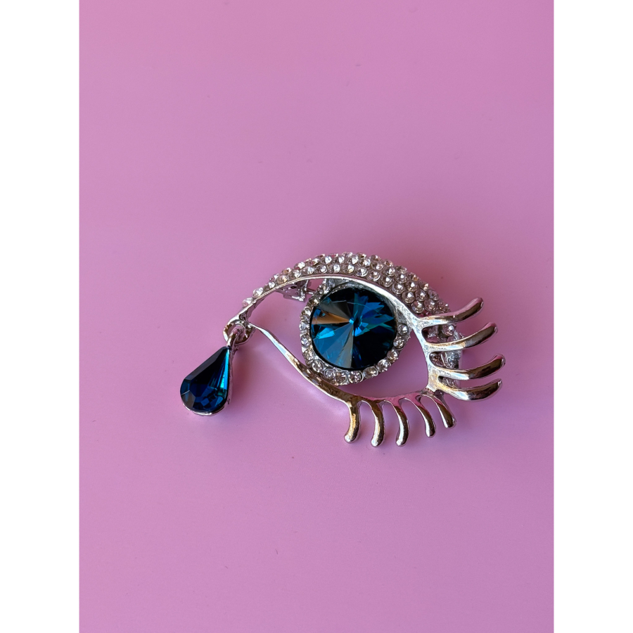 Øje Broche med turkise sten fra LÉ MOSCH, broche formet som et øje med en tåre, sølvfarvet broche med blå sten,