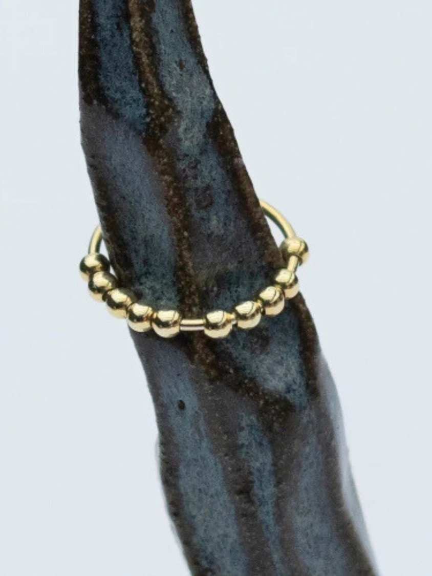 Vilje anti stress ring i blank forgyldt fra LÉ MOSCH,